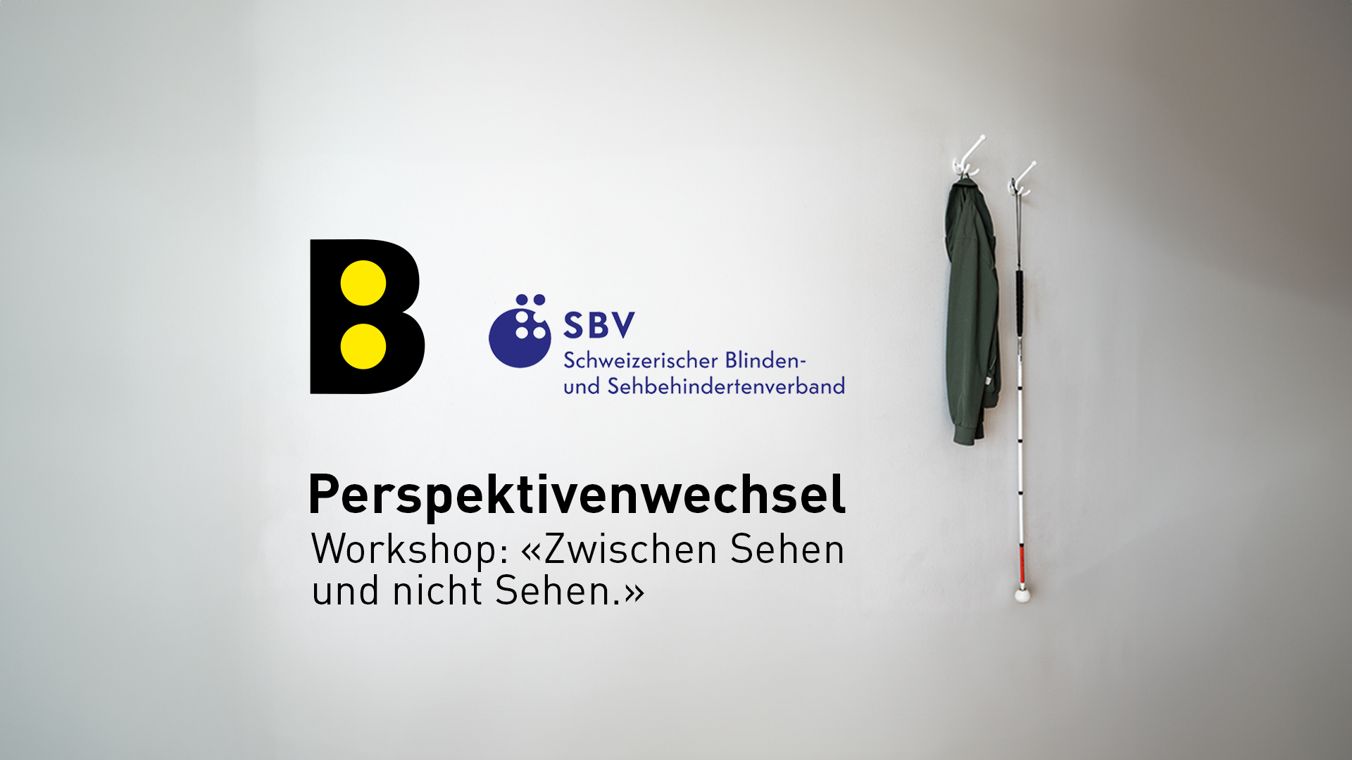 B Logo, Jacke und Blindenstock